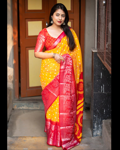 Yellow Red Soft Jute Silk Bandhni Print Saree With Red Blouse
